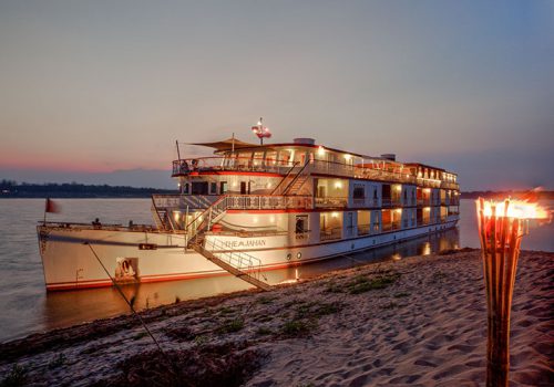 Jahan by the river bank at night